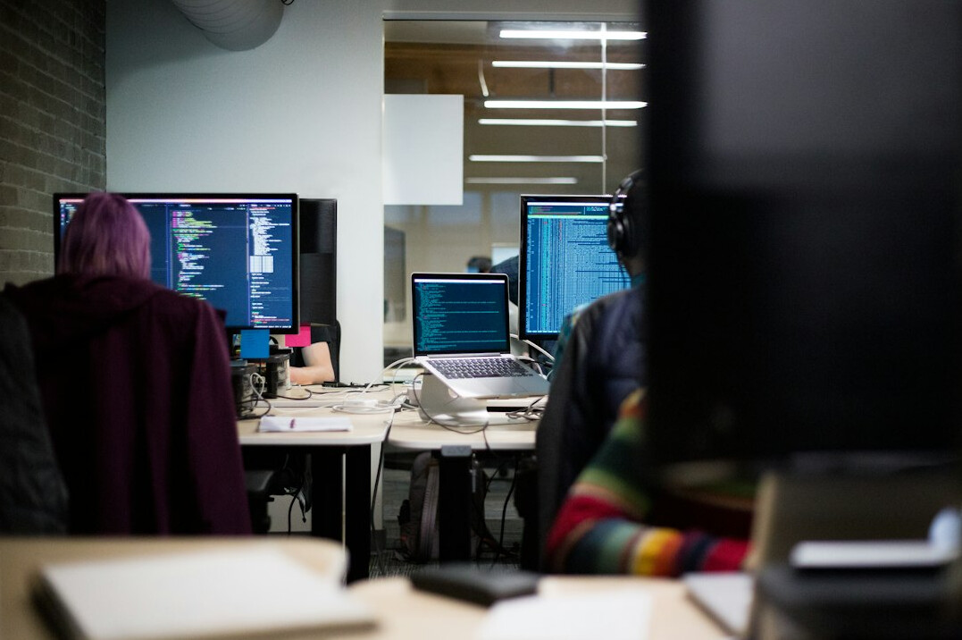 software developers coding together